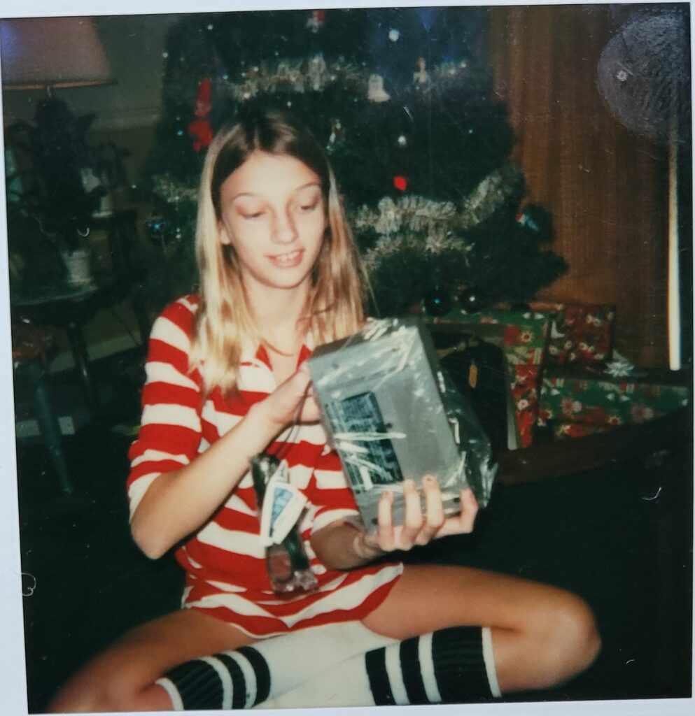 young sandy opens presents